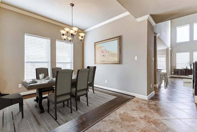 tiled dining area featuring ornamental molding and a notable chandelier