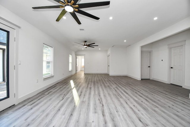 unfurnished living room with light hardwood / wood-style flooring and ceiling fan