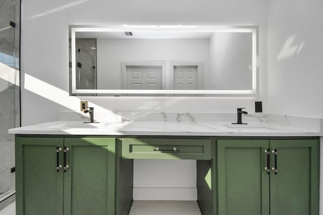 bathroom featuring tile patterned floors, vanity, and walk in shower