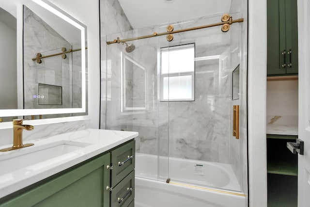 bathroom featuring vanity and bath / shower combo with glass door