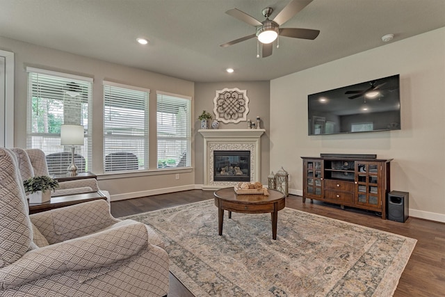 living room with dark hardwood / wood-style flooring, plenty of natural light, and ceiling fan