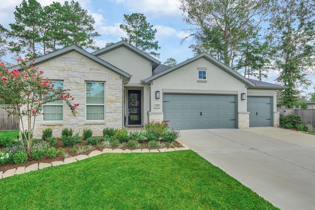 view of front of house featuring a front yard and a garage