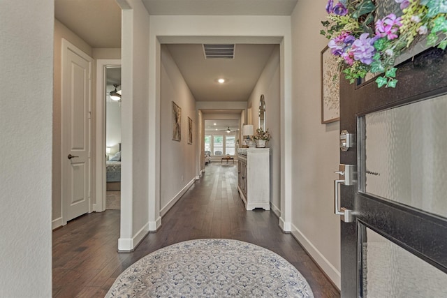 entryway with dark hardwood / wood-style floors