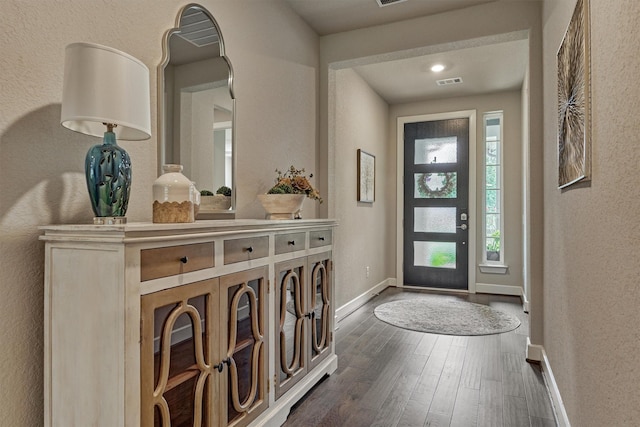 entryway with dark hardwood / wood-style floors