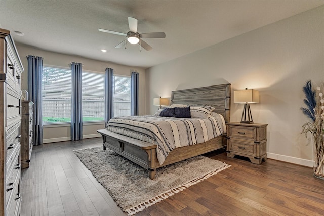 bedroom featuring ceiling fan and dark wood-type flooring