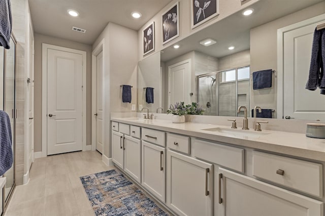 bathroom with vanity and walk in shower