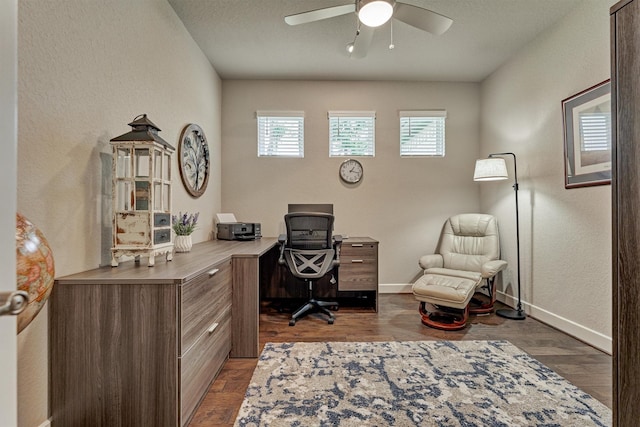 home office featuring ceiling fan and dark wood-type flooring