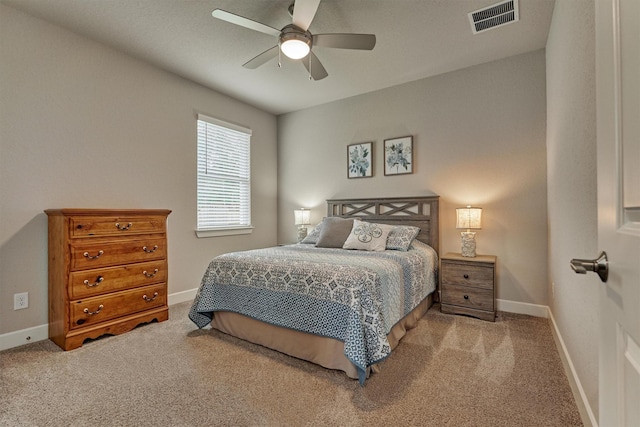 bedroom with ceiling fan and light carpet