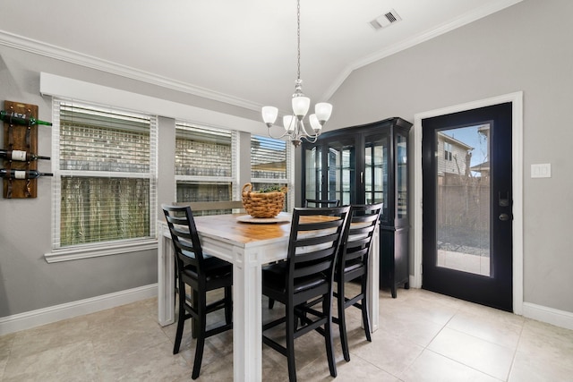 dining space with crown molding, light tile patterned floors, a chandelier, and vaulted ceiling