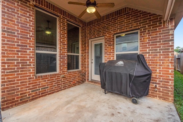 view of patio featuring ceiling fan and a grill