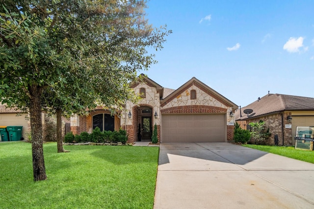 view of front of home with a front yard and a garage