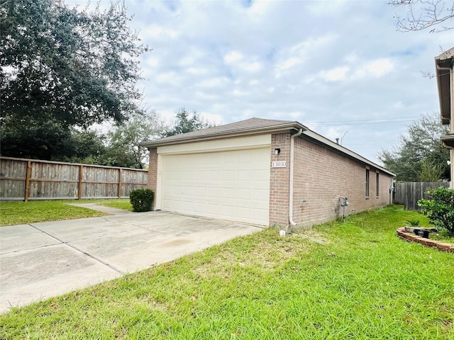 garage featuring a lawn