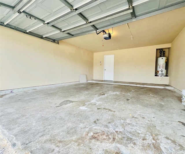 garage with a garage door opener and gas water heater