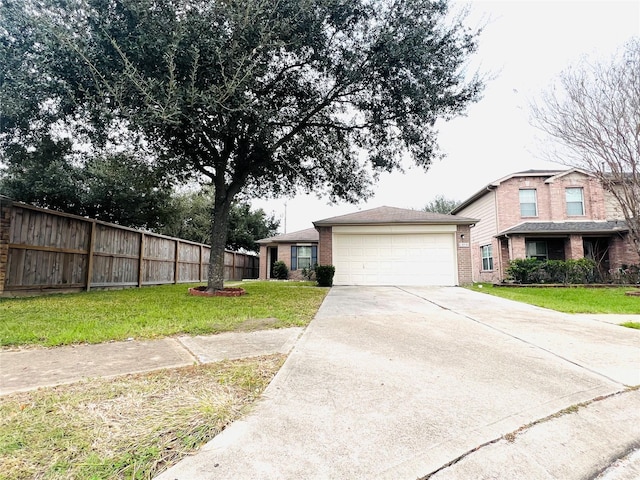 view of front of house featuring a garage and a front lawn