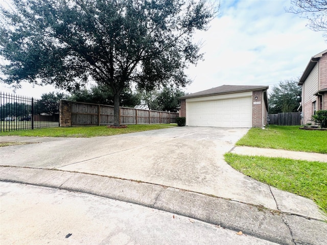 garage featuring a yard