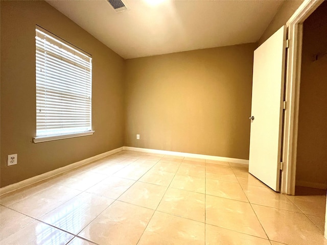 unfurnished bedroom featuring light tile patterned floors