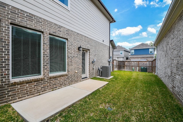 view of yard featuring a patio area and central AC unit