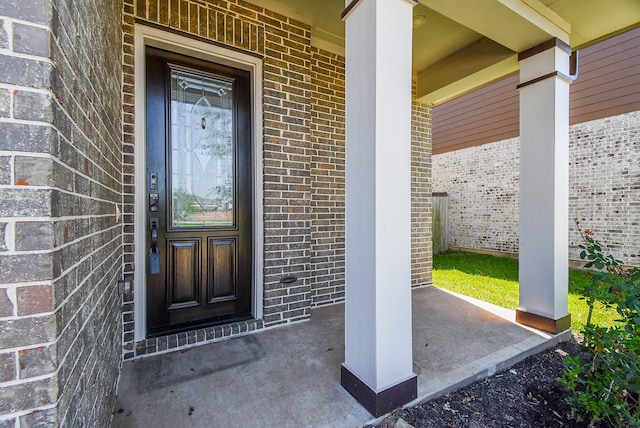 entrance to property featuring a porch