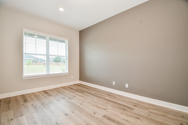 spare room featuring light hardwood / wood-style floors