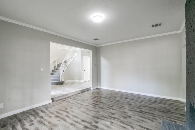 unfurnished room featuring hardwood / wood-style flooring and ornamental molding