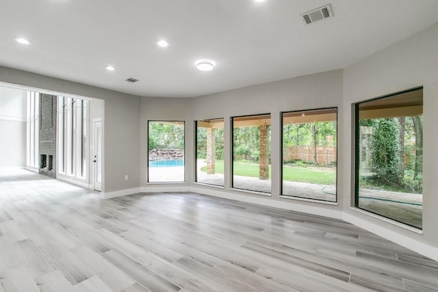 spare room featuring light wood-type flooring