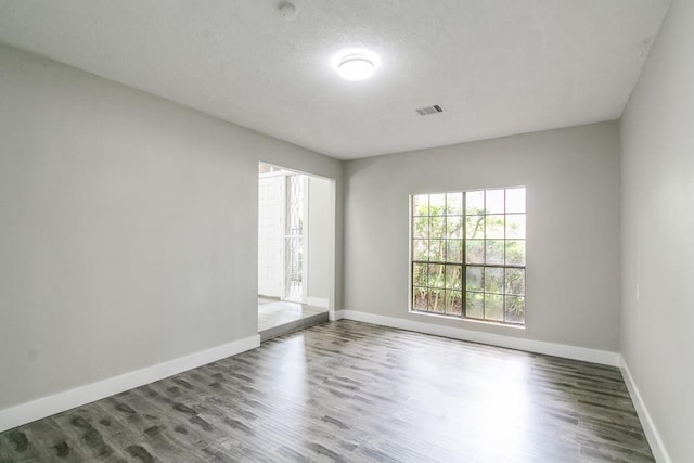 empty room featuring hardwood / wood-style floors