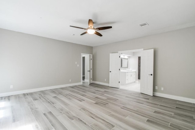 unfurnished bedroom featuring ceiling fan, light hardwood / wood-style floors, and ensuite bathroom