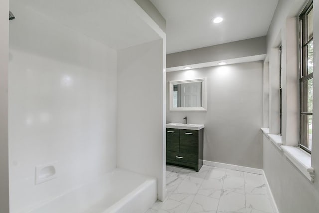 bathroom featuring shower / tub combination and vanity