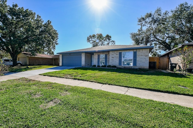 ranch-style house with a front yard and a garage