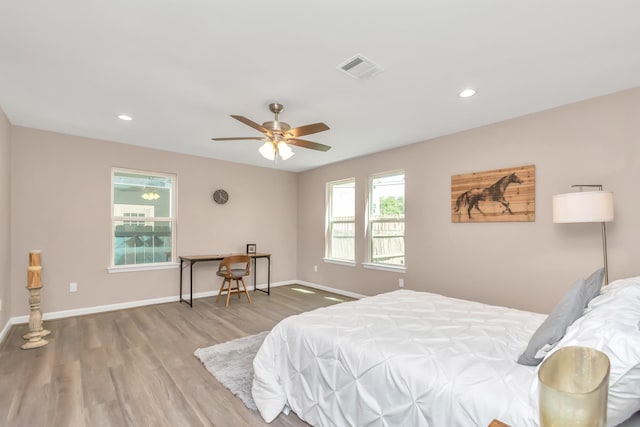 bedroom with hardwood / wood-style flooring and ceiling fan