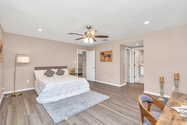 bedroom with ceiling fan and wood-type flooring