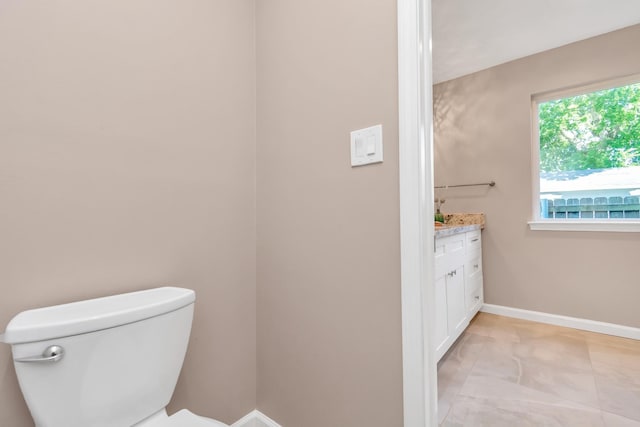 bathroom featuring toilet and vanity