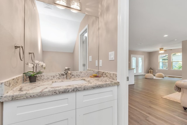 bathroom featuring hardwood / wood-style floors, ceiling fan, and vanity