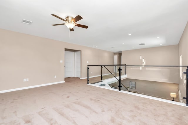 carpeted empty room with ceiling fan