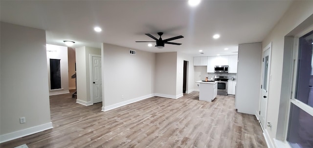 interior space featuring ceiling fan and light hardwood / wood-style flooring