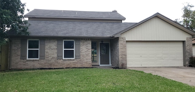 view of front of house featuring a garage and a front yard