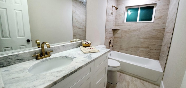 full bathroom with vanity, toilet, and tiled shower / bath