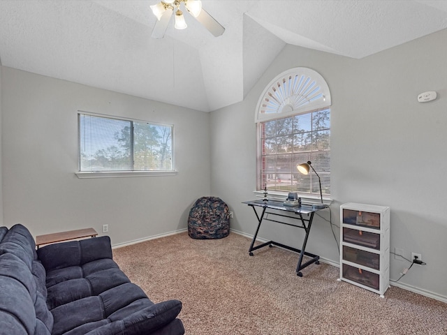 living area featuring a wealth of natural light, lofted ceiling, and carpet flooring