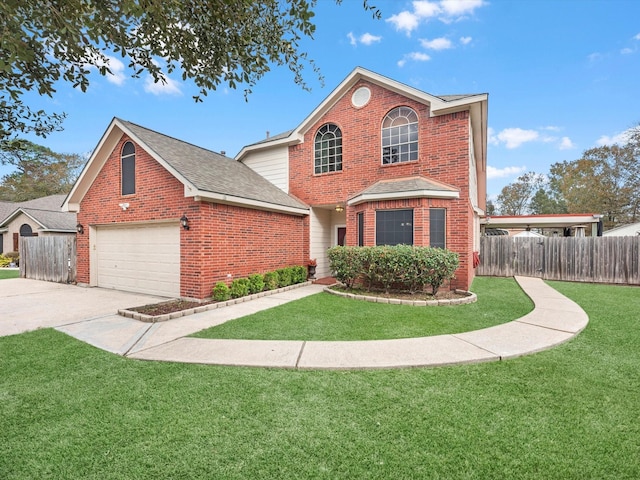 view of property featuring a front lawn and a garage