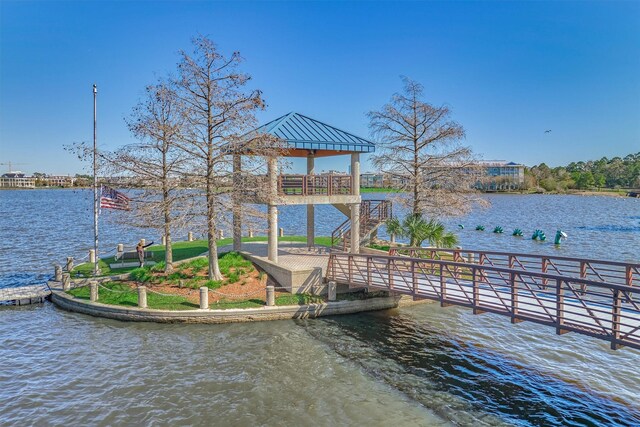 view of dock featuring a gazebo and a water view