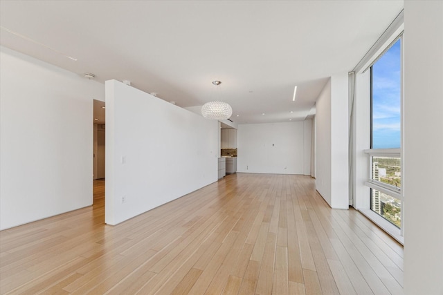 unfurnished living room featuring light hardwood / wood-style flooring