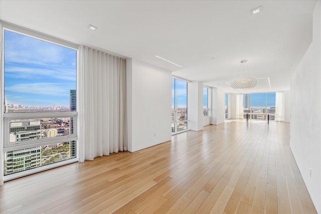 unfurnished room with a wealth of natural light and floor to ceiling windows