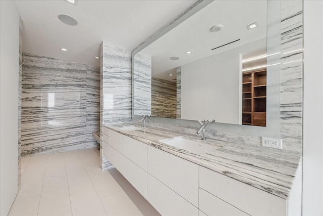 bathroom with vanity, tile walls, and tile patterned floors