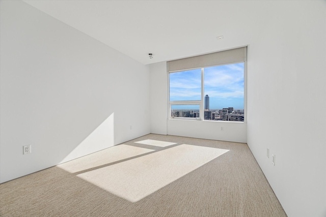 empty room with light colored carpet