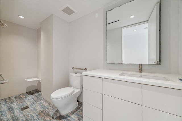 bathroom with toilet and vanity