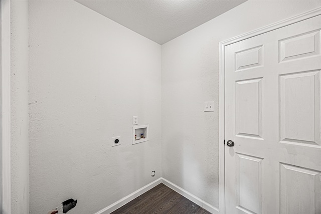 clothes washing area with a textured ceiling, washer hookup, dark hardwood / wood-style floors, and hookup for an electric dryer