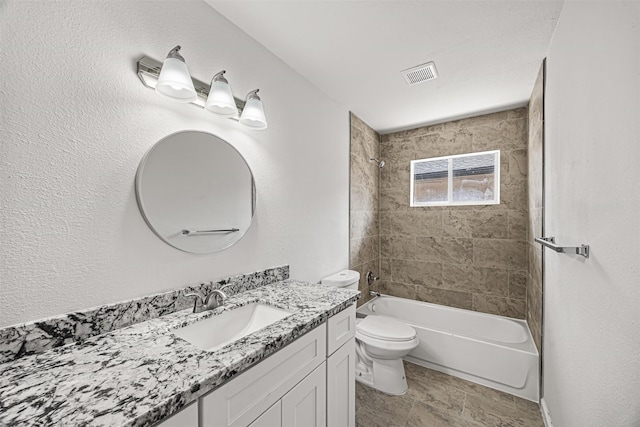 full bathroom featuring vanity, toilet, and tiled shower / bath