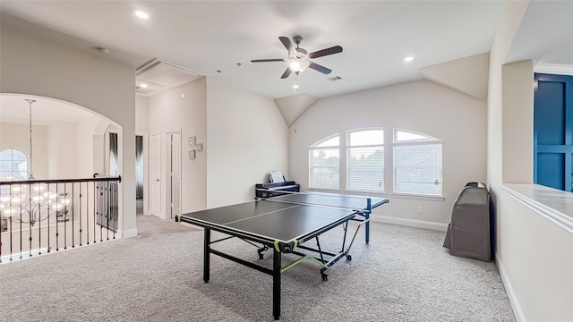 game room featuring carpet flooring, ceiling fan with notable chandelier, and lofted ceiling