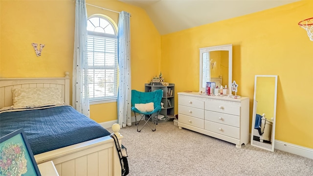 bedroom with carpet and vaulted ceiling