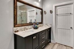 bathroom with vanity and wood-type flooring